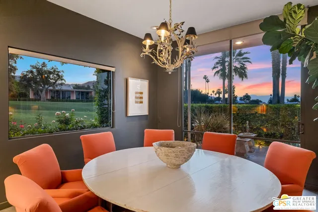 a swimming pool with outdoor seating and yard