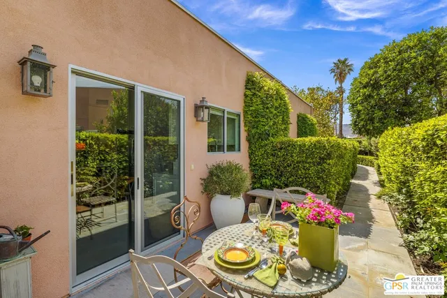 a living room with furniture fireplace and window