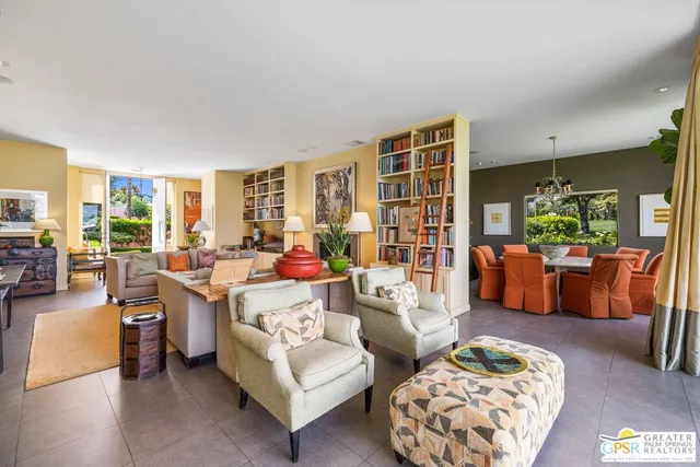 a view of a swimming pool with a table and chairs