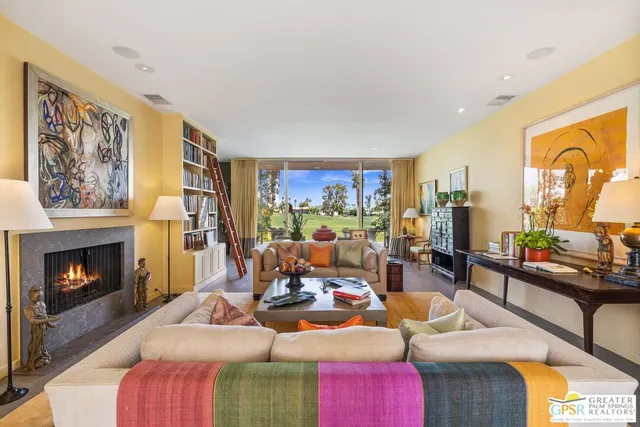 a bedroom with a bed and large window