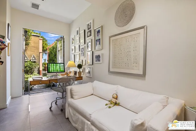 a view of a big building with a mountain in the background