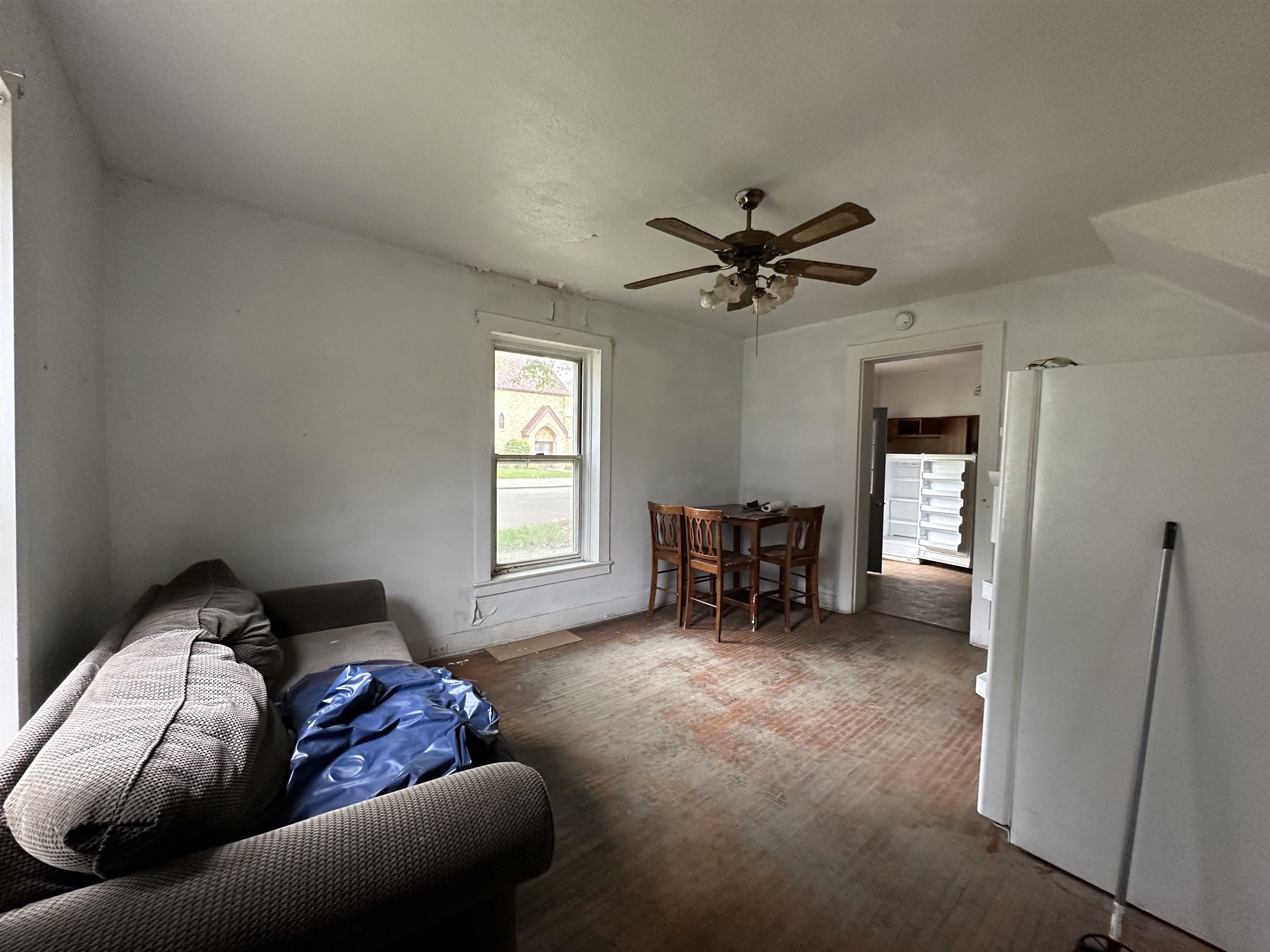 131 3rd Street Savanna, IL 61074 - Photo 16 of 16 a living room with furniture and a ceiling fan