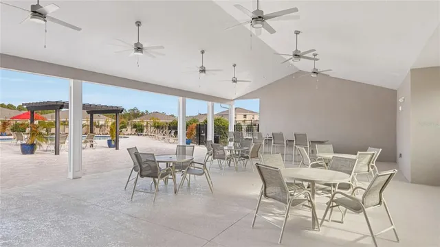a dining room with furniture water view and a chandelier