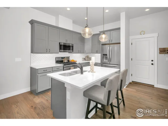 a kitchen with a table and chairs in it