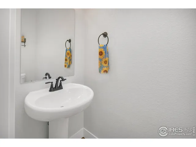 a bathroom with a sink and mirror