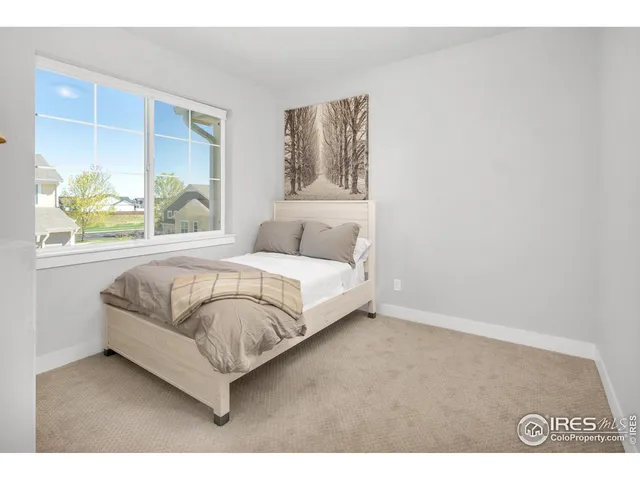 a large white bed in a white room