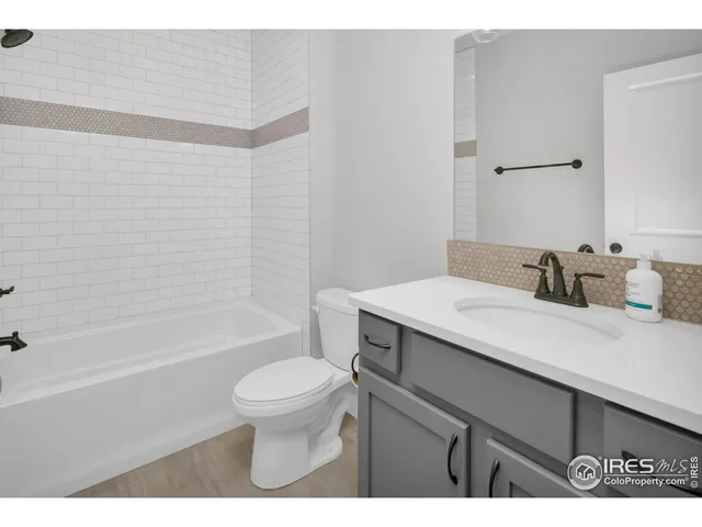 a bathroom with a sink a toilet and a bathtub