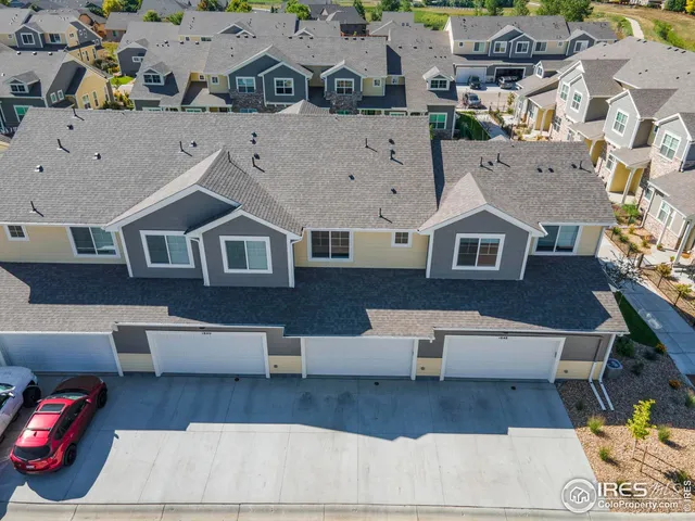 an aerial view of a house with wooden floor
