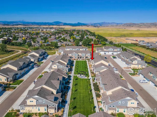 a view of a city with a lake