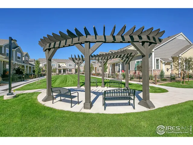 a view of a table and chairs in patio with a yard