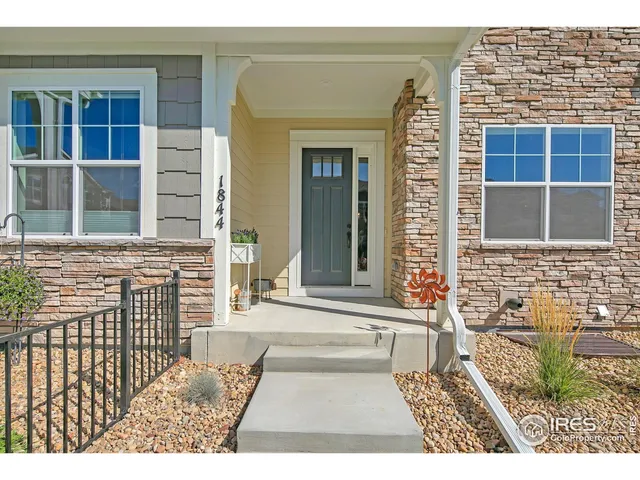 a view of a brick house with a window
