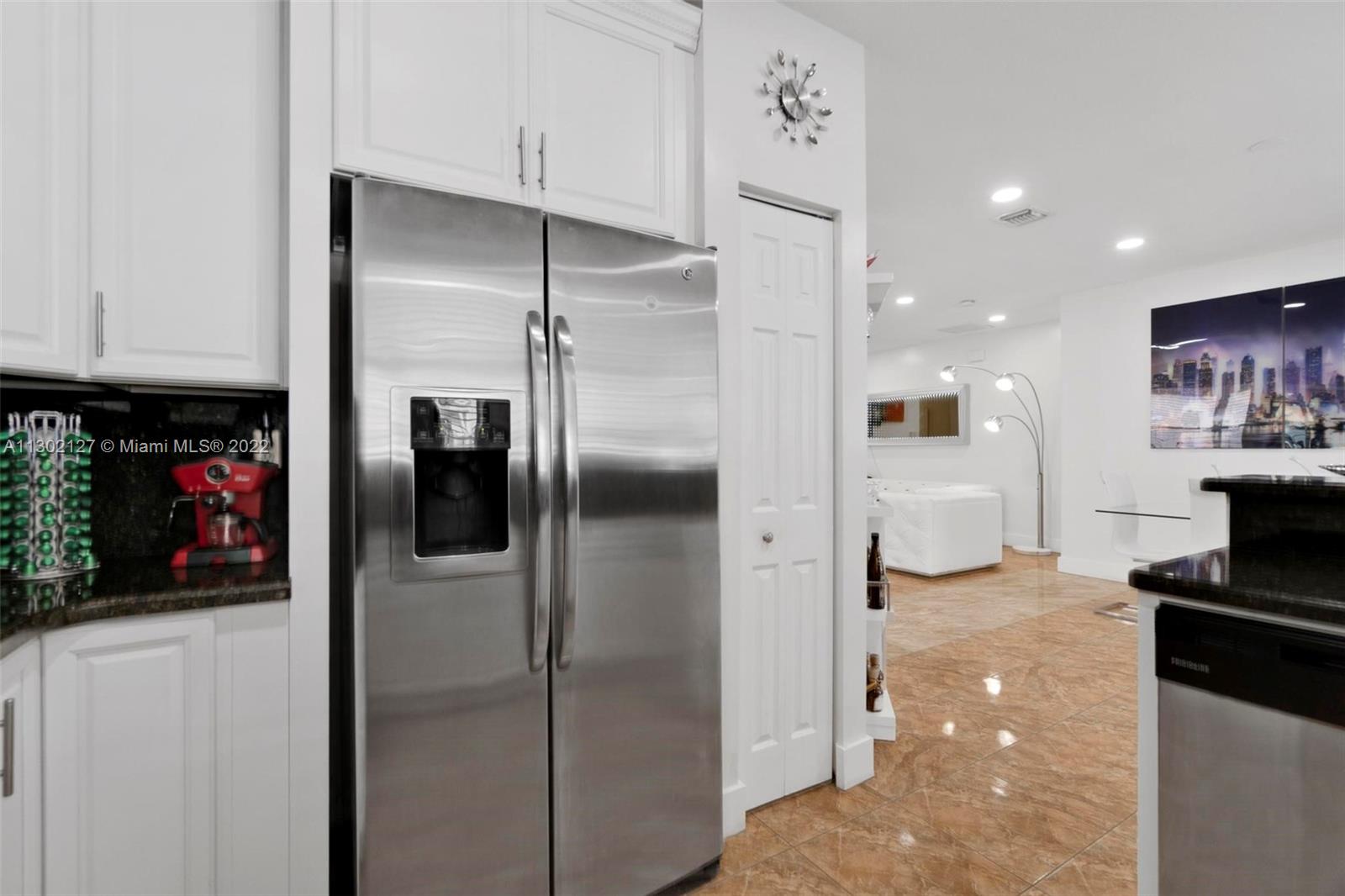 10837 Southwest 246th Street Homestead, FL 33032 - Photo 14 of 44 a kitchen with stainless steel appliances granite countertop a refrigerator and a stove