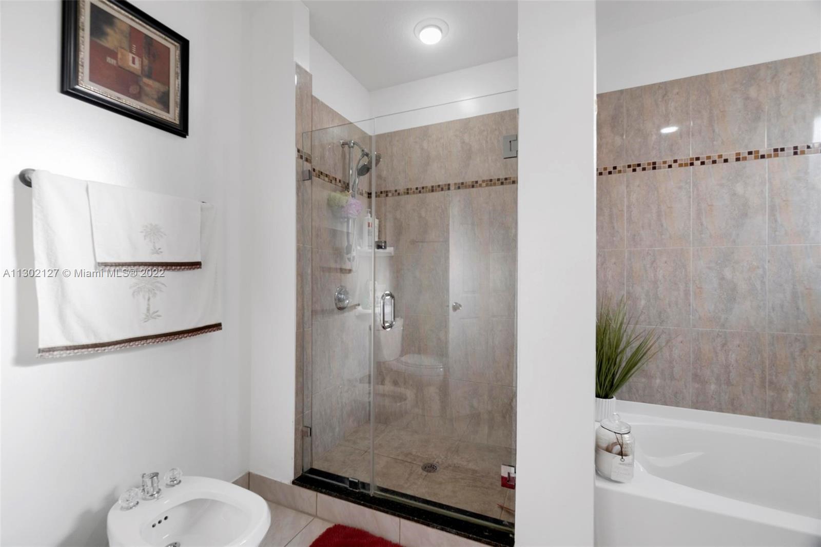 10837 Southwest 246th Street Homestead, FL 33032 - Photo 21 of 44 a bathroom with a shower and a toilet