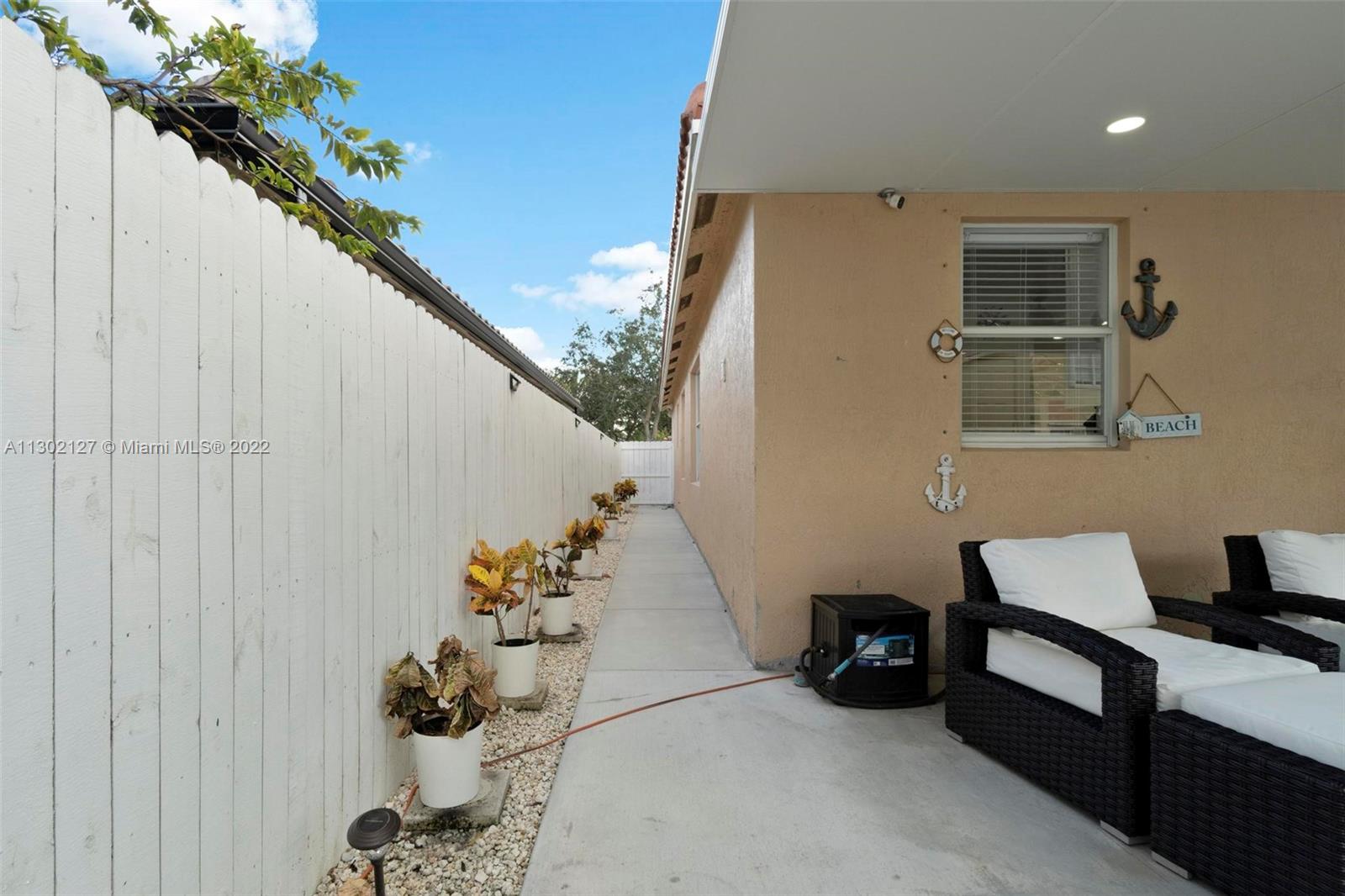10837 Southwest 246th Street Homestead, FL 33032 - Photo 34 of 44 a room with a table and a potted plant