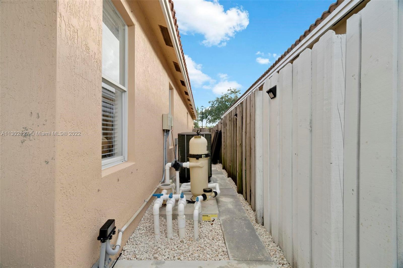 10837 Southwest 246th Street Homestead, FL 33032 - Photo 35 of 44 a view of a balcony with furniture and entryway