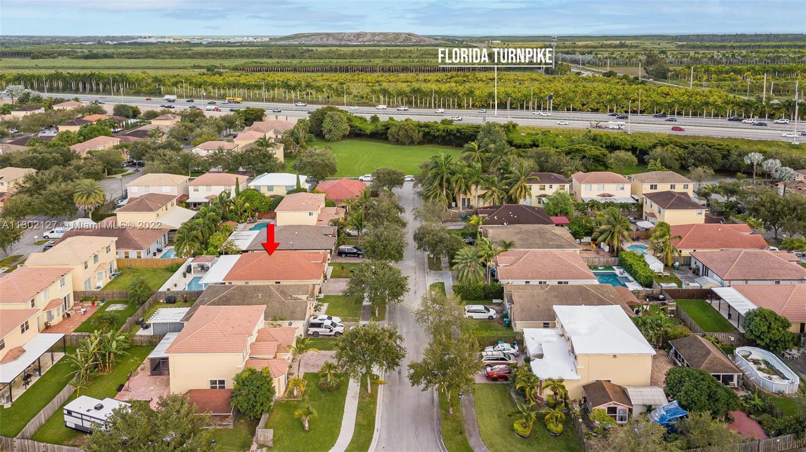 10837 Southwest 246th Street Homestead, FL 33032 - Photo 36 of 44 an aerial view of residential building with outdoor space and ocean view