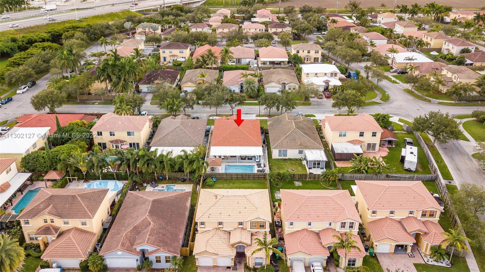 10837 Southwest 246th Street Homestead, FL 33032 - Photo 38 of 44 an aerial view of residential houses with outdoor space