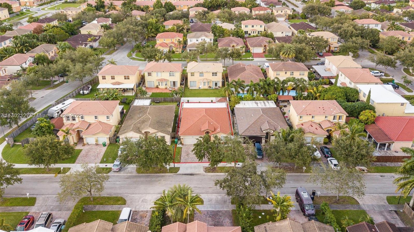 10837 Southwest 246th Street Homestead, FL 33032 - Photo 39 of 44 an aerial view of residential houses with outdoor space