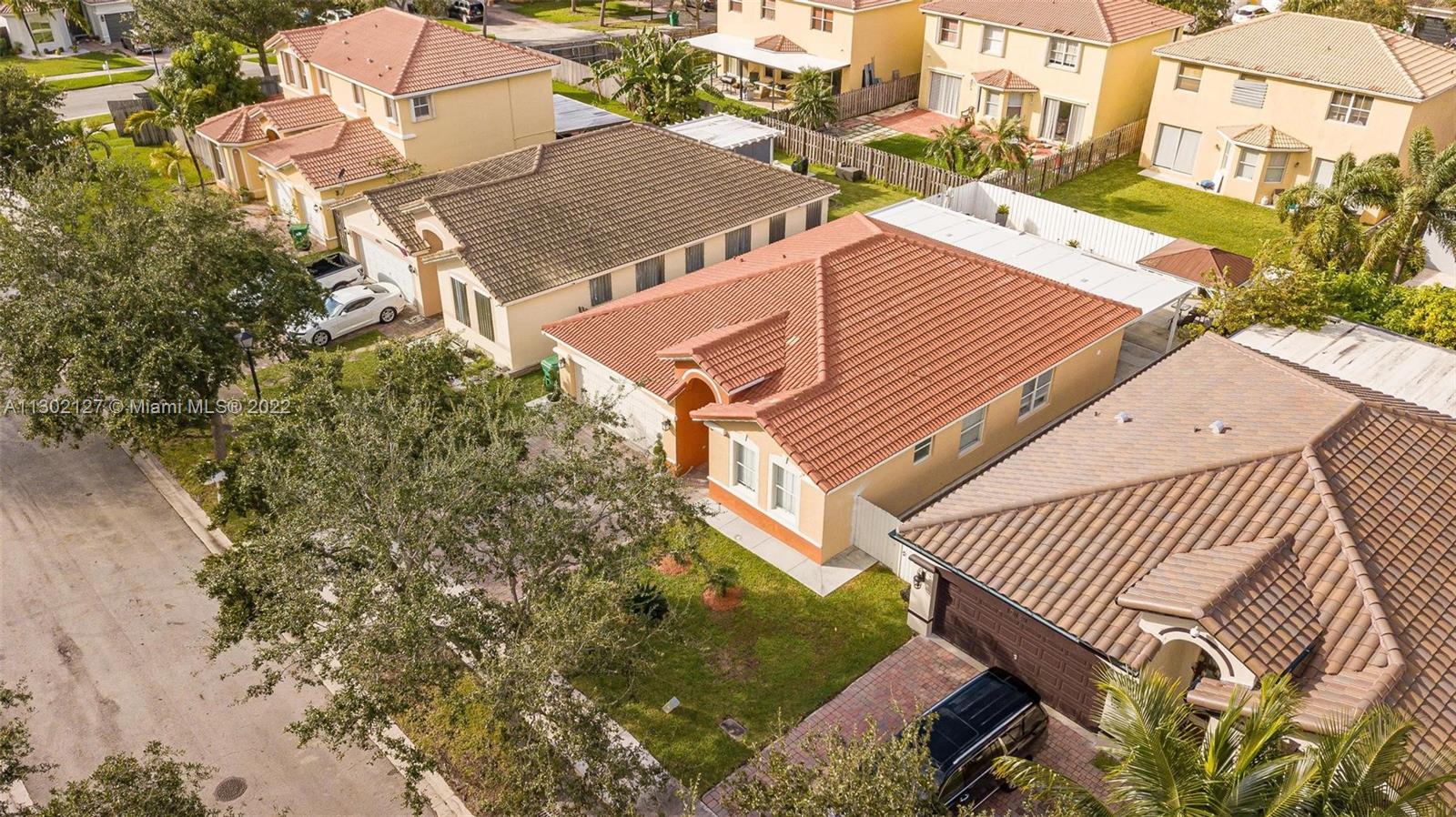 10837 Southwest 246th Street Homestead, FL 33032 - Photo 40 of 44 an aerial view of a house with a yard