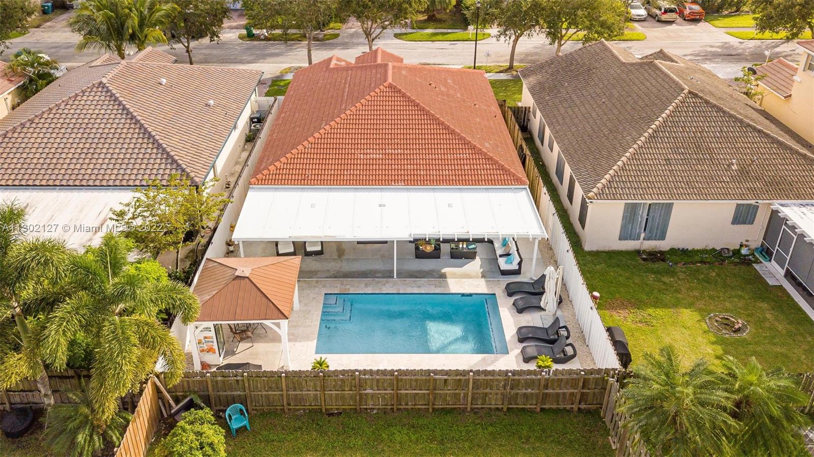 10837 Southwest 246th Street Homestead, FL 33032 - Photo 43 of 44 swimming pool view with a outdoor seating space
