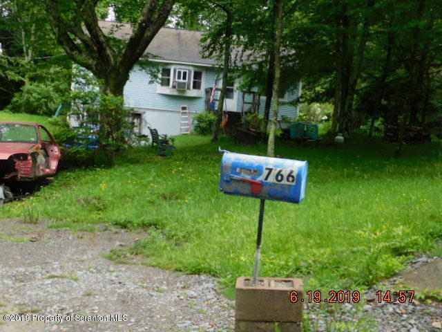 766 Hemlock Road Waymart, PA 18472 - Photo 1 of 7 a sign of golf club on a wall