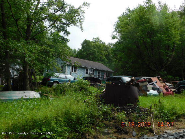 766 Hemlock Road Waymart, PA 18472 - Photo 4 of 7 a view of house with yard and green space