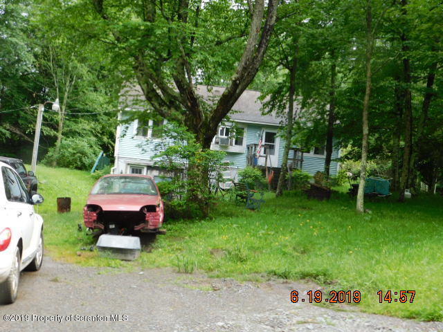 766 Hemlock Road Waymart, PA 18472 - Photo 7 of 7 a backyard of a house with table and chairs