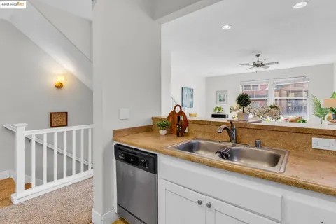 a kitchen with stainless steel appliances a refrigerator stove and microwave