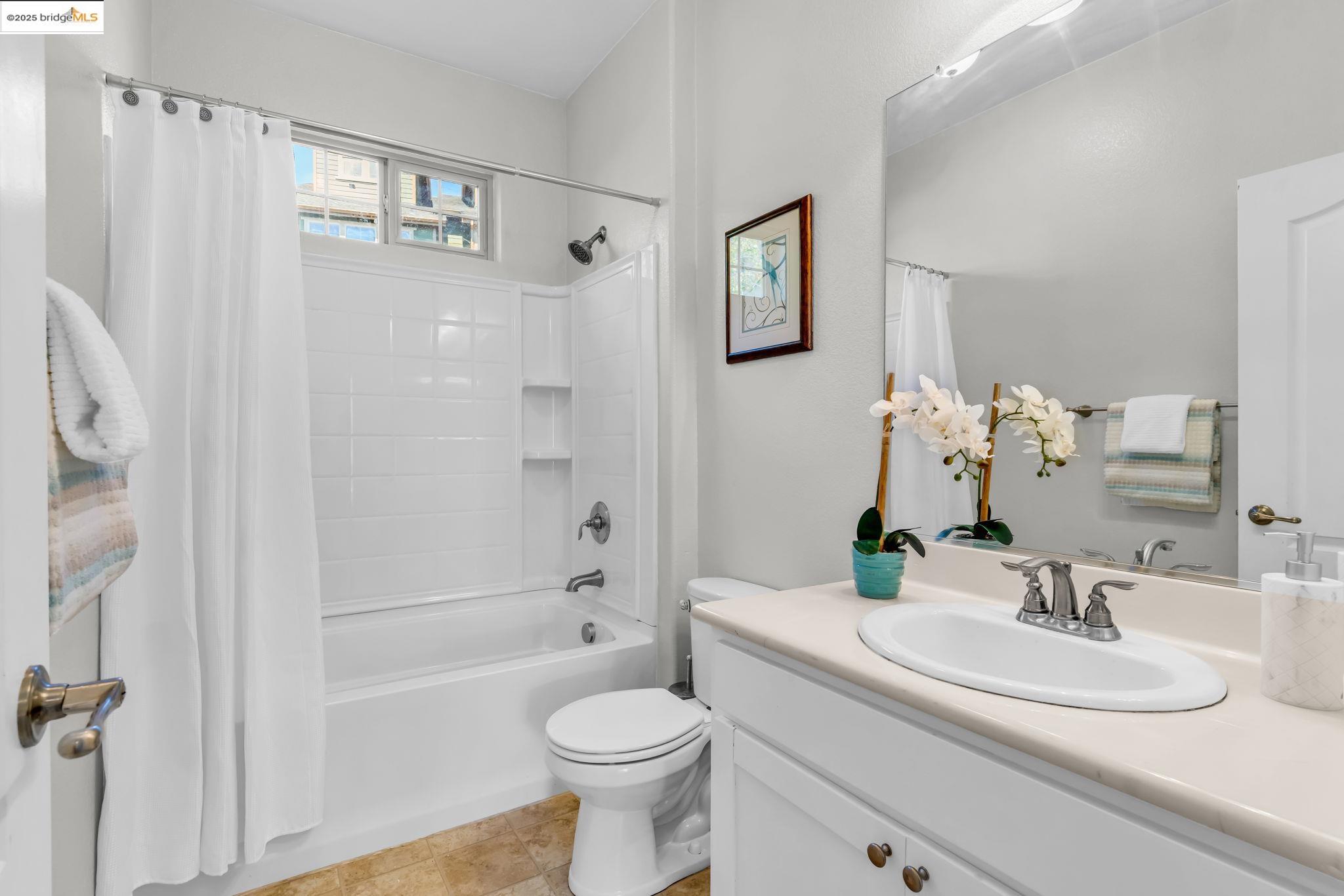 6063 Old Quarry Loop Oakland, CA 94605 - Photo 14 of 36 a bathroom with a sink toilet and shower