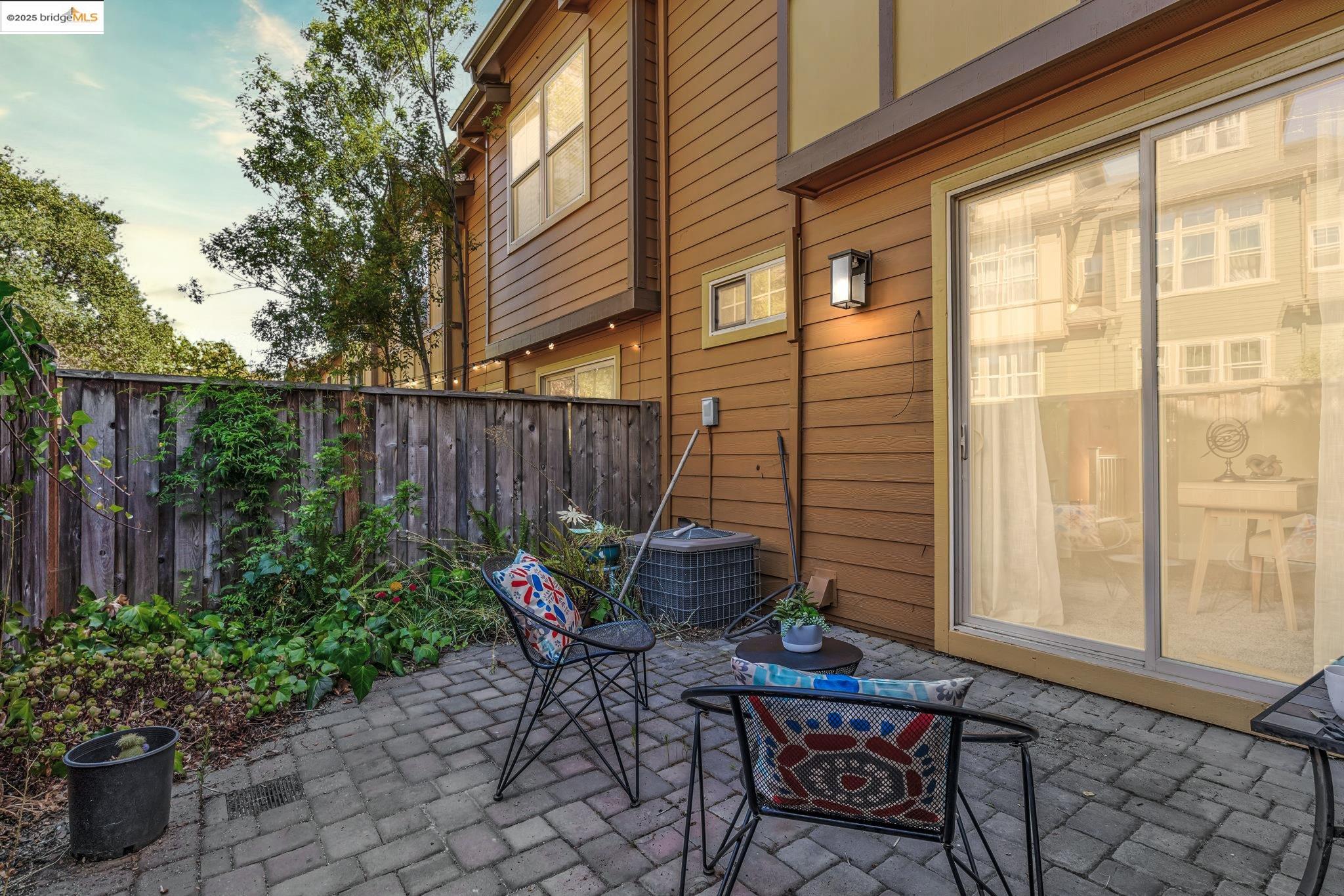 6063 Old Quarry Loop Oakland, CA 94605 - Photo 17 of 36 a backyard of a house with table and chairs
