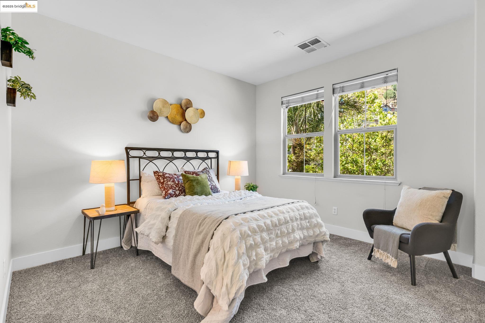 6063 Old Quarry Loop Oakland, CA 94605 - Photo 19 of 36 a bedroom with a bed and a window