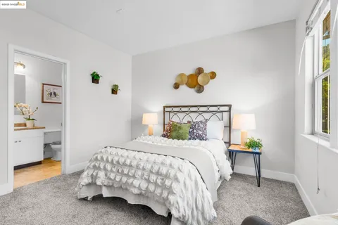 a bedroom with a bed and a table in it