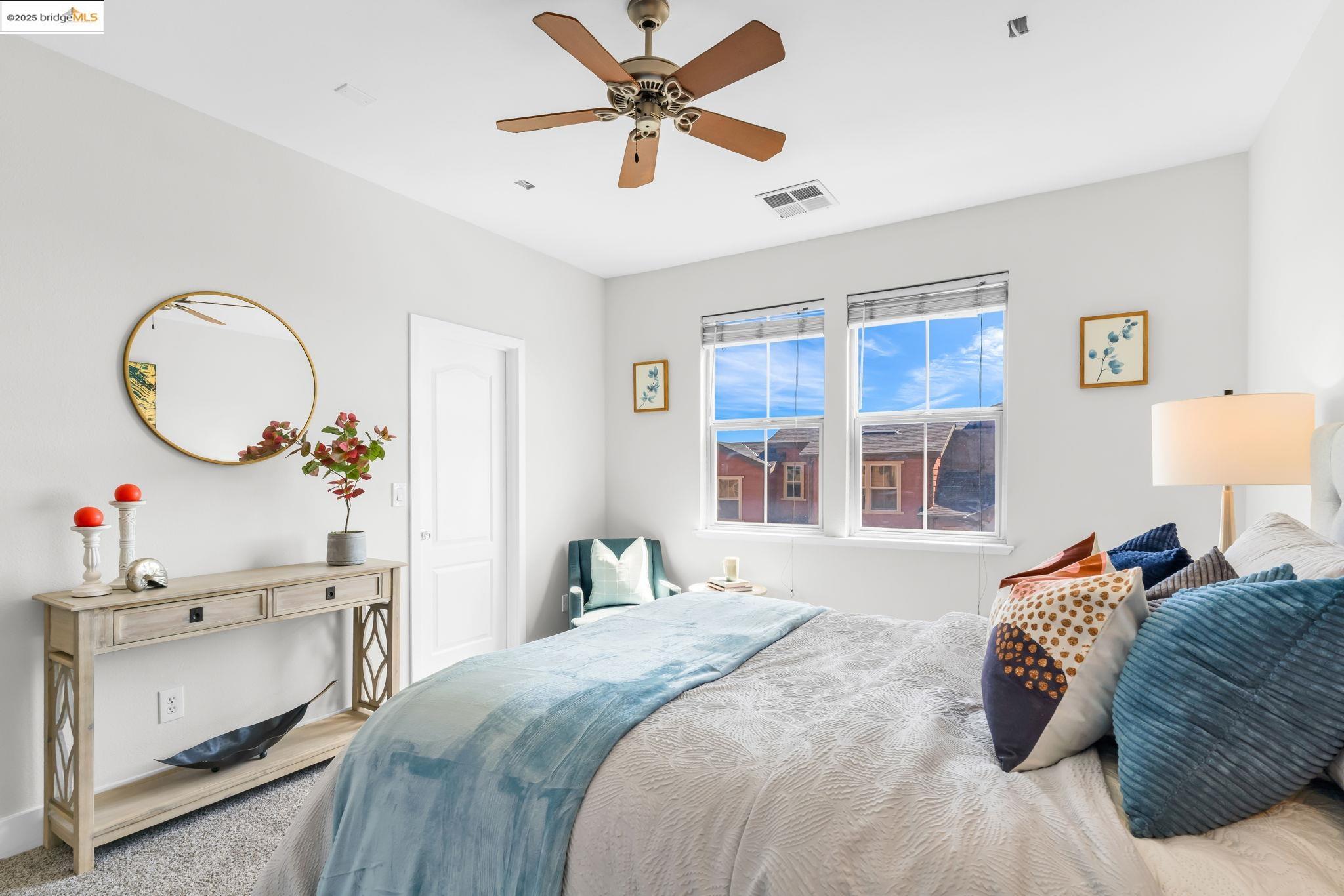 6063 Old Quarry Loop Oakland, CA 94605 - Photo 26 of 36 a bedroom with a bed dresser and a window