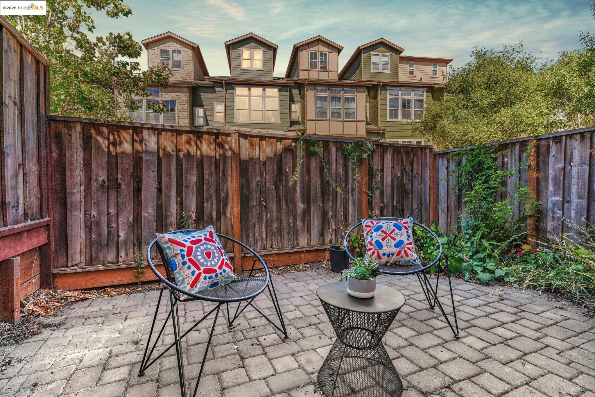 6063 Old Quarry Loop Oakland, CA 94605 - Photo 28 of 36 a view of a chairs and table in a backyard