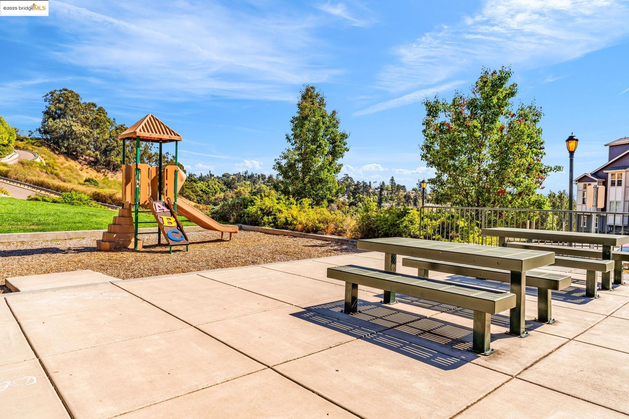 6063 Old Quarry Loop Oakland, CA 94605 - Photo 29 of 36 a view of a bench in a patio with a bench and trees