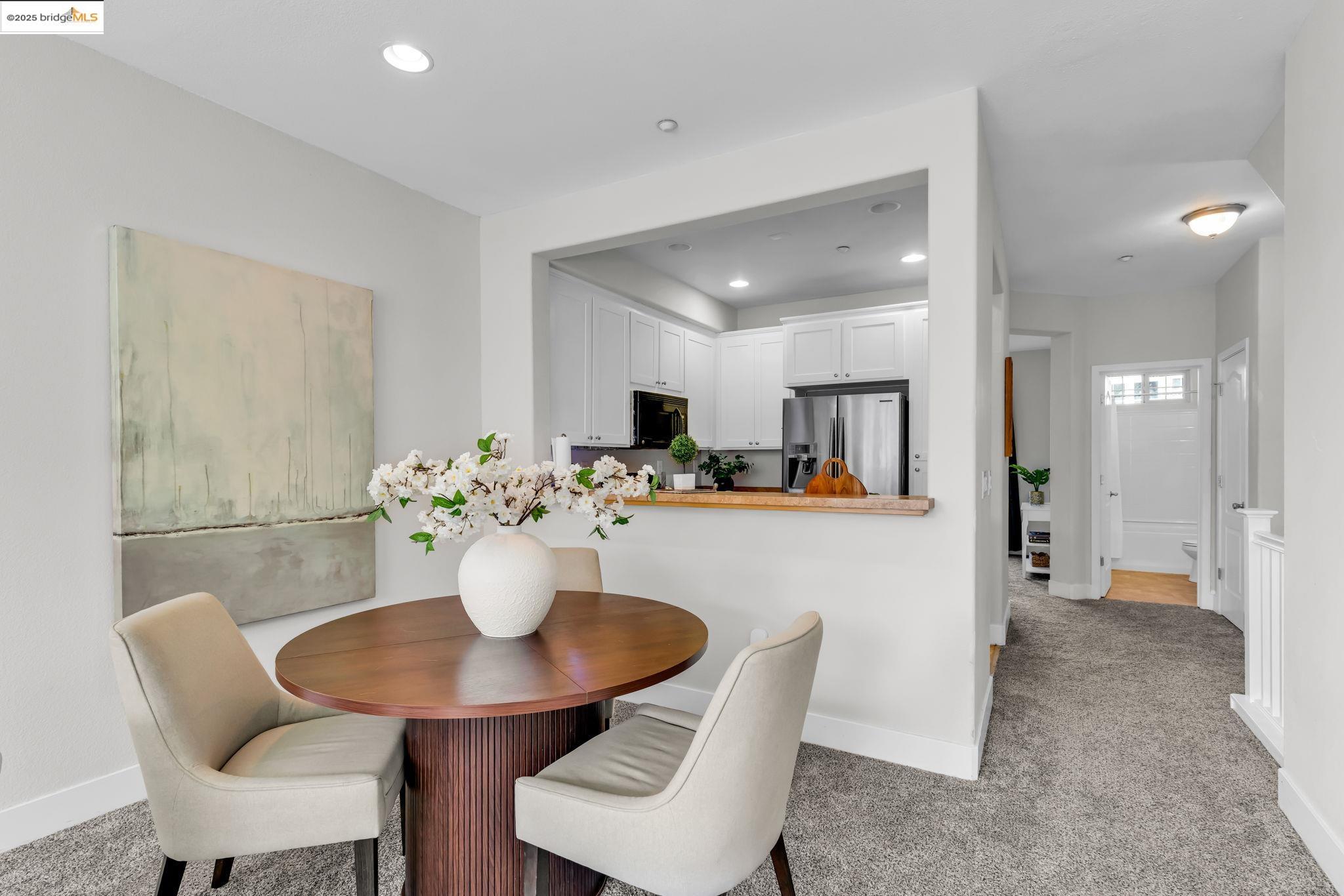 6063 Old Quarry Loop Oakland, CA 94605 - Photo 8 of 36 a view of a dining room with furniture and wooden floor
