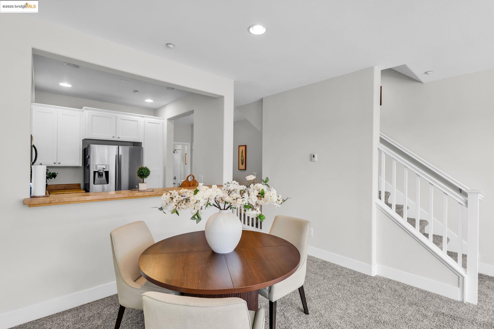 6063 Old Quarry Loop Oakland, CA 94605 - Photo 9 of 36 a view of a dining room with furniture and a potted plant