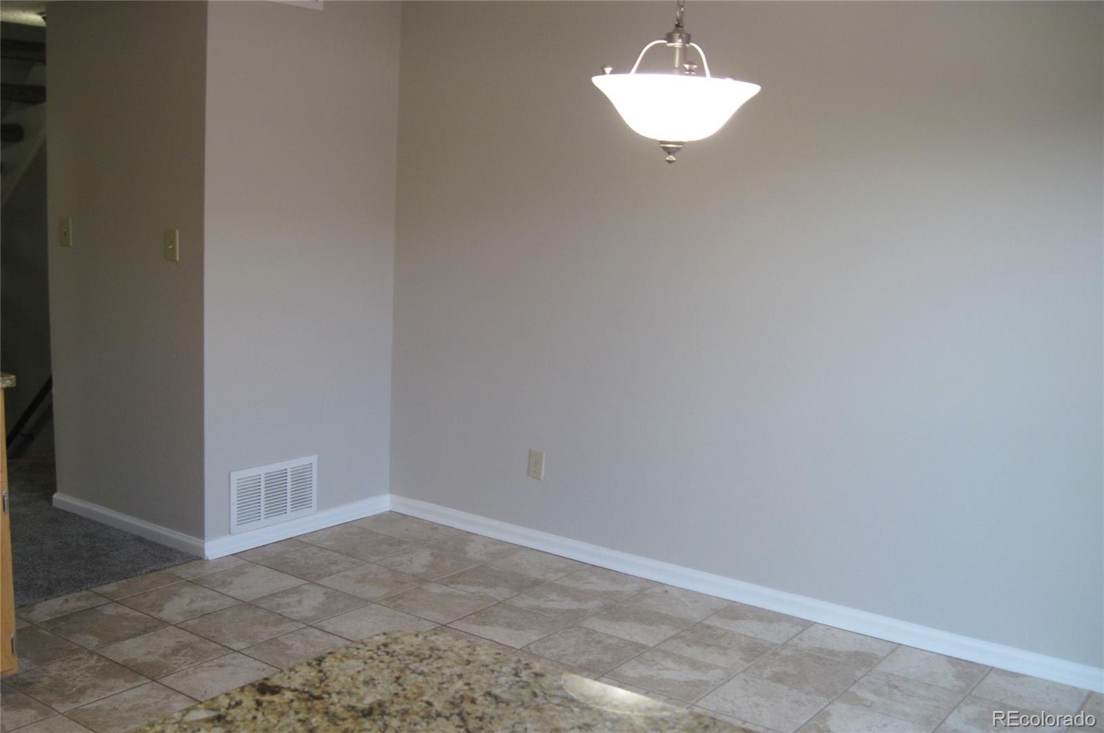 258 West Rockrimmon Boulevard, Unit F Colorado Springs, CO 80919 - Photo 13 of 41 a bathroom with a light fixture