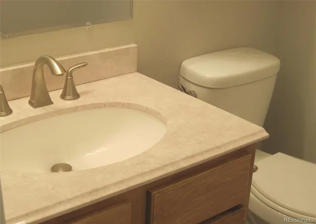 a bathroom with a sink and toilet