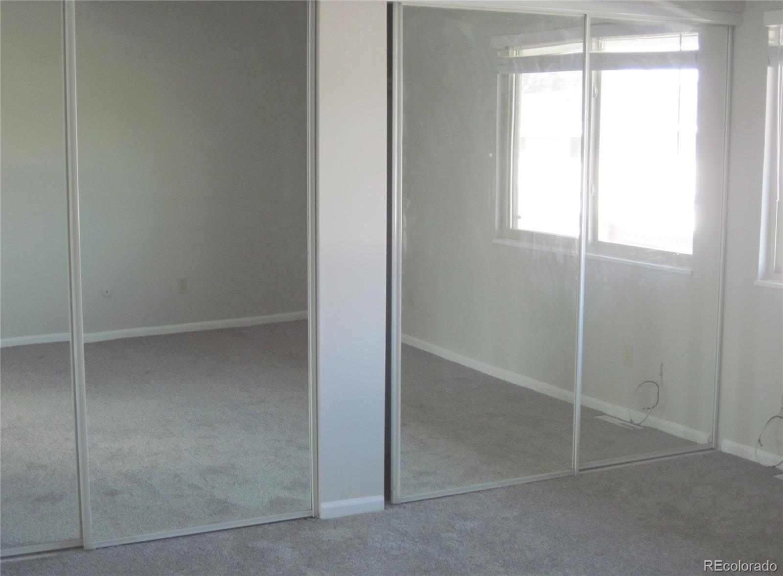 258 West Rockrimmon Boulevard, Unit F Colorado Springs, CO 80919 - Photo 19 of 41 a view of an empty room with a window