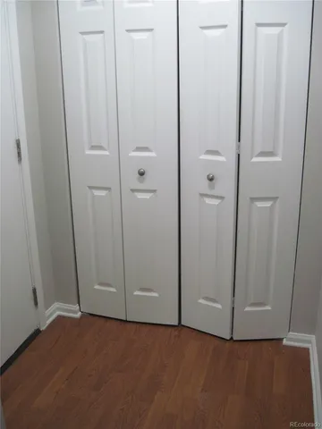 an empty room with closet area