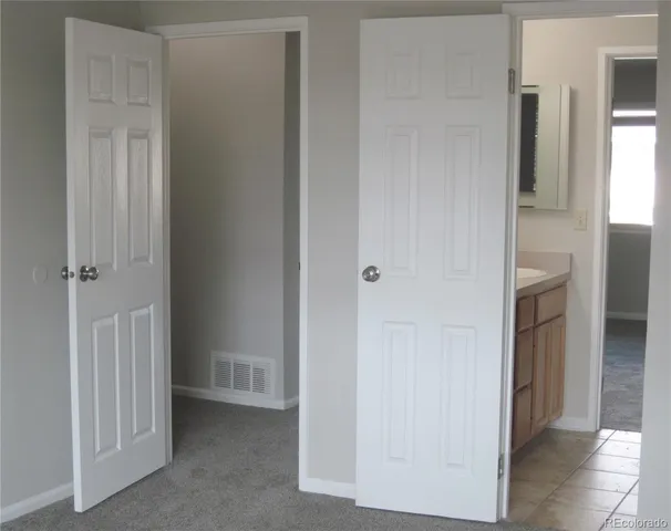 a view of a bathroom from the hallway