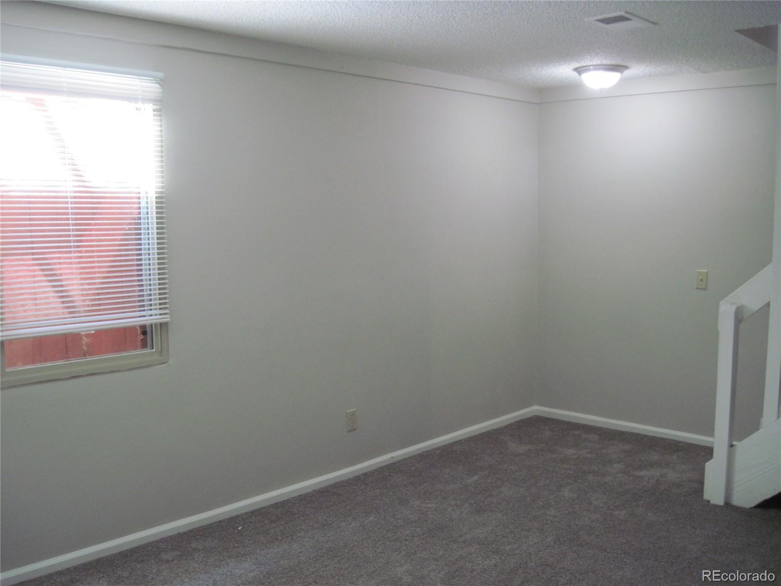 258 West Rockrimmon Boulevard, Unit F Colorado Springs, CO 80919 - Photo 28 of 41 an empty room with a window