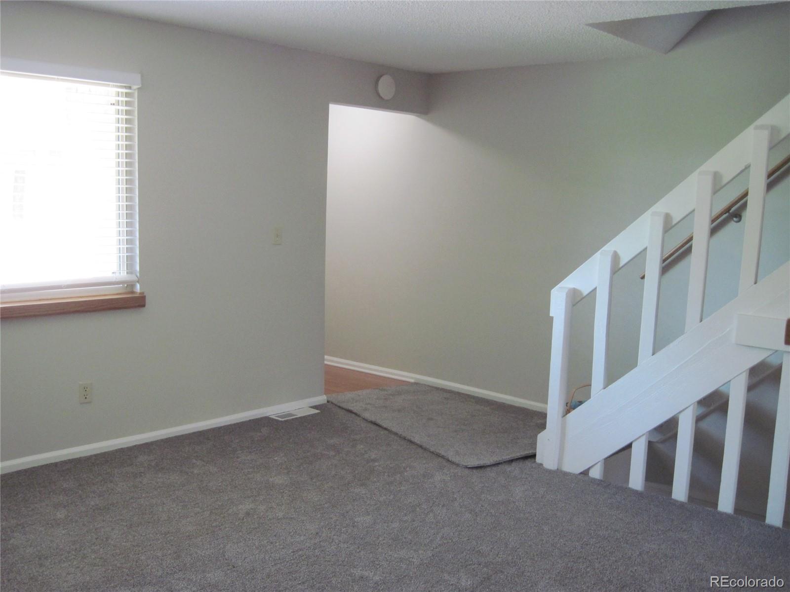 258 West Rockrimmon Boulevard, Unit F Colorado Springs, CO 80919 - Photo 3 of 41 an empty room with windows