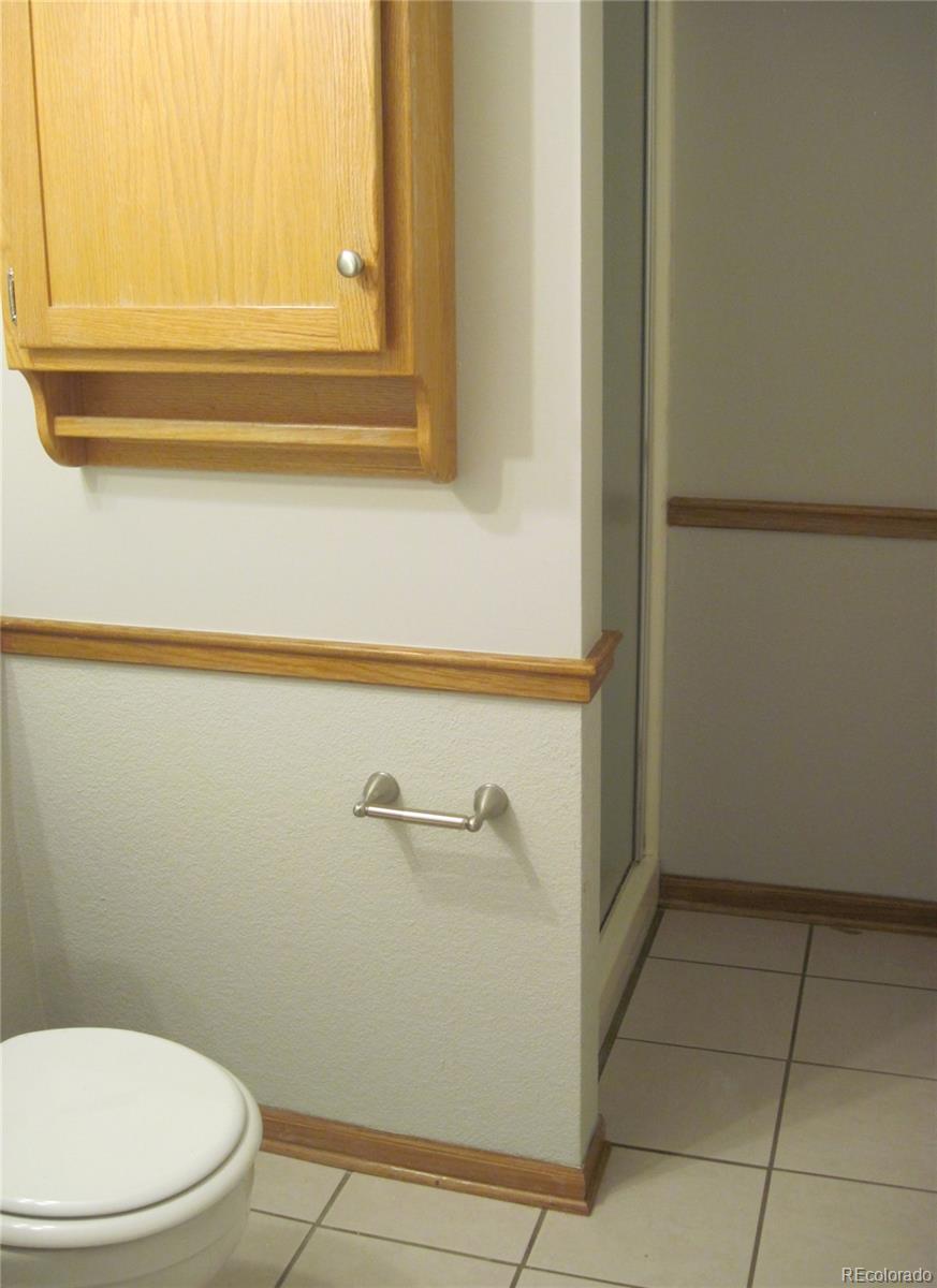 258 West Rockrimmon Boulevard, Unit F Colorado Springs, CO 80919 - Photo 32 of 41 a bathroom with a toilet and a bathtub