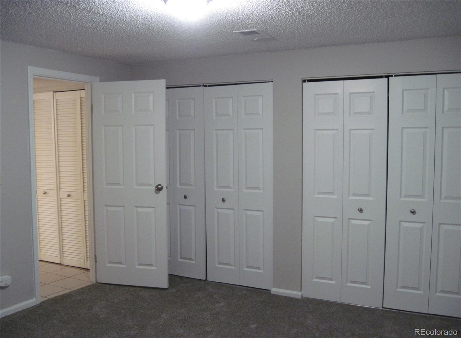 258 West Rockrimmon Boulevard, Unit F Colorado Springs, CO 80919 - Photo 33 of 41 a view of room with closet area