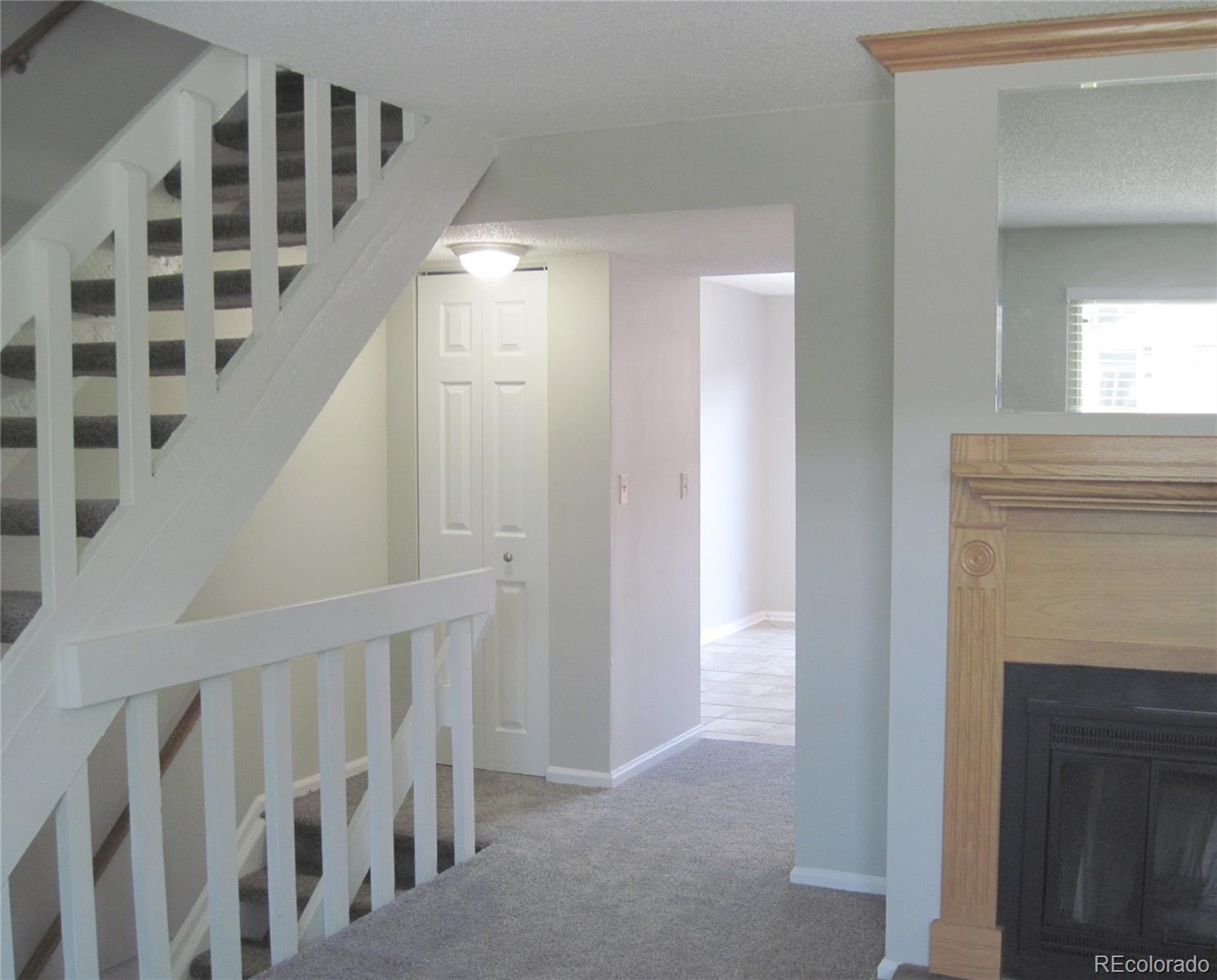 258 West Rockrimmon Boulevard, Unit F Colorado Springs, CO 80919 - Photo 5 of 41 a view of a hallway with windows and stairs