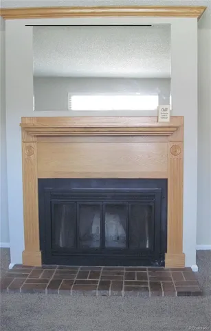 a living room with a fireplace