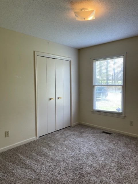 1875 Needmore Road Clarksville, TN 37042 - Photo 13 of 20 an empty room with a empty space and windows