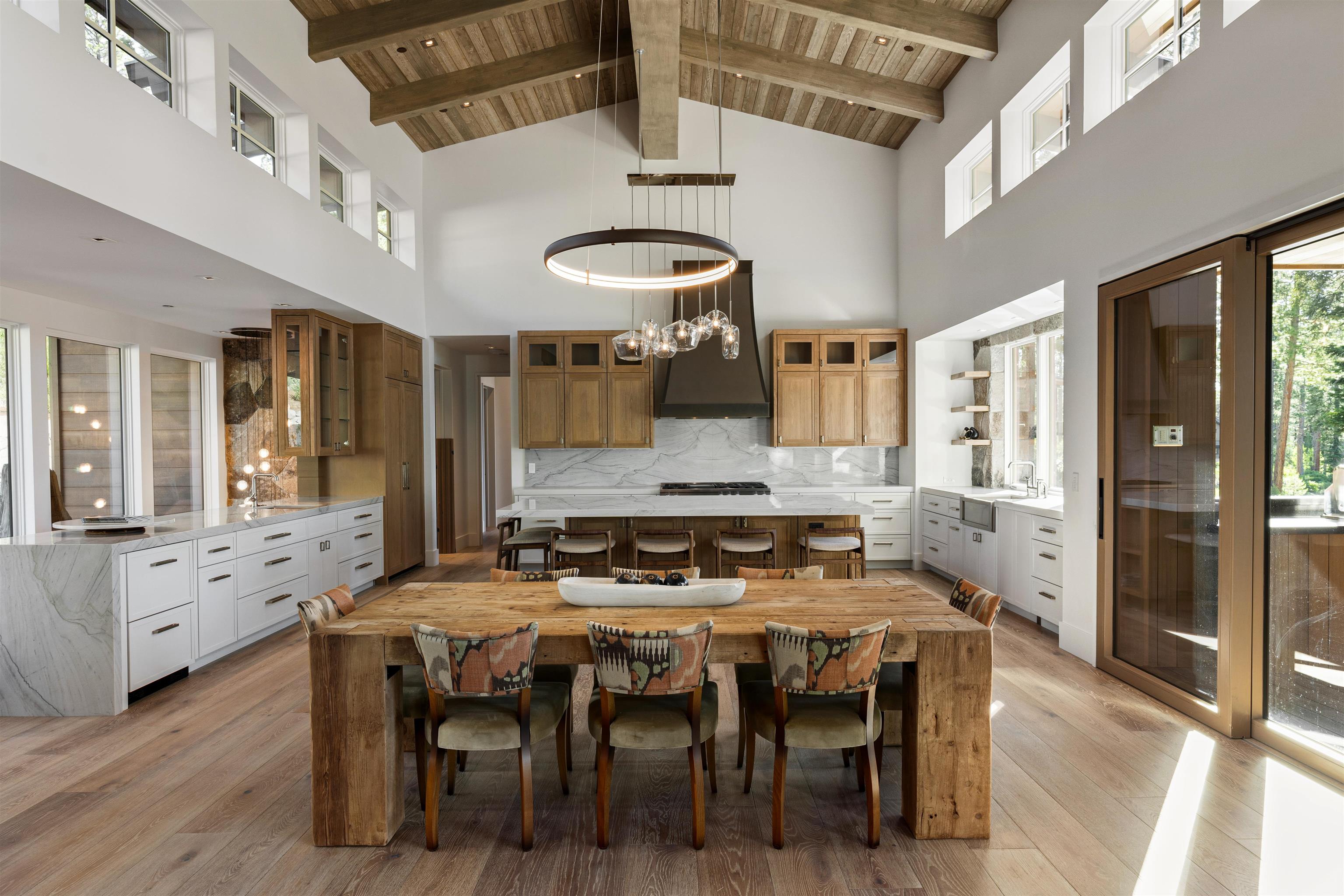 8207 Ehrman Drive Truckee, CA 96161 - Photo 3 of 21 a view of a dining room with furniture and wooden floor